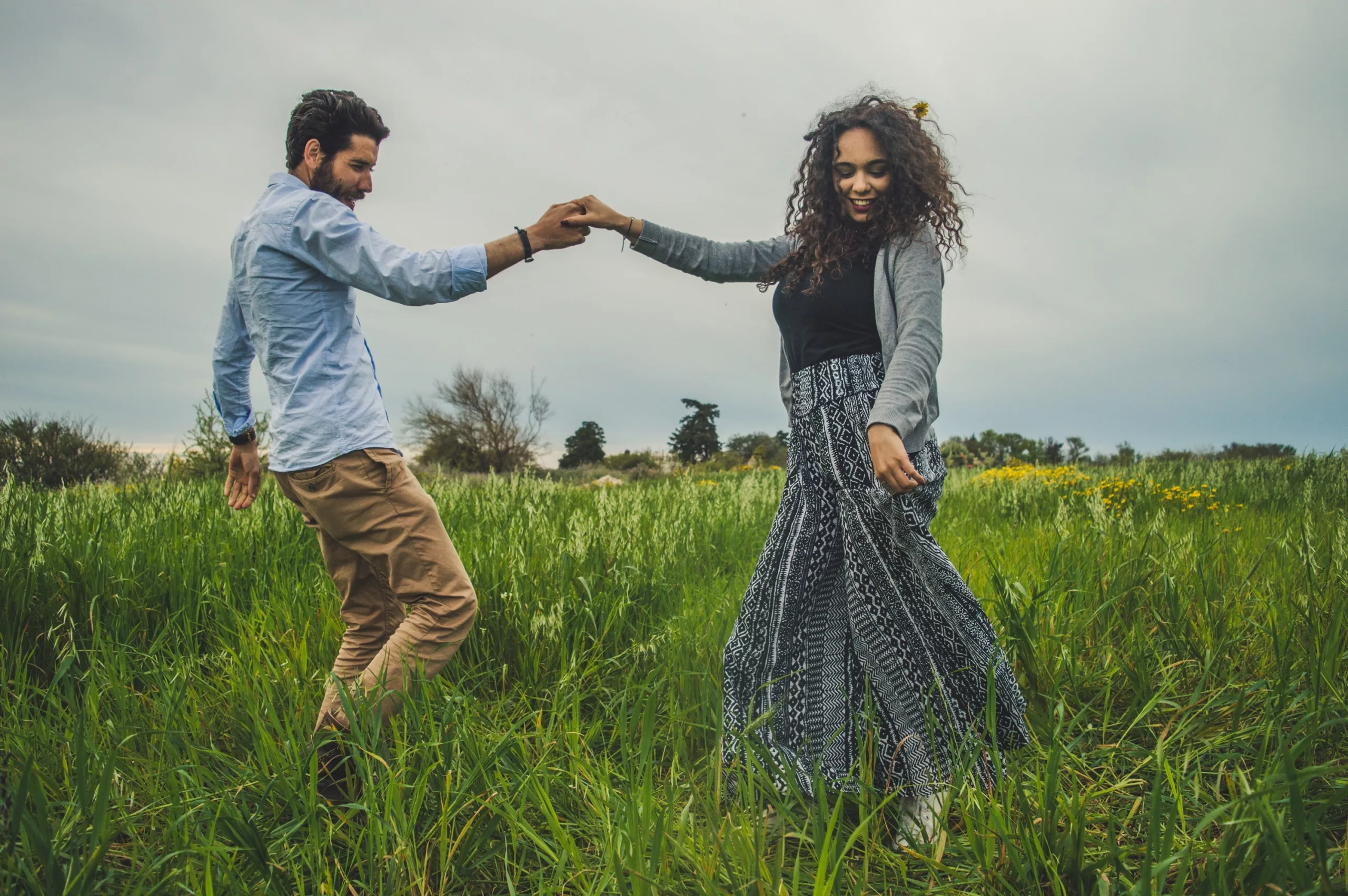 Couple dancing in a meadow